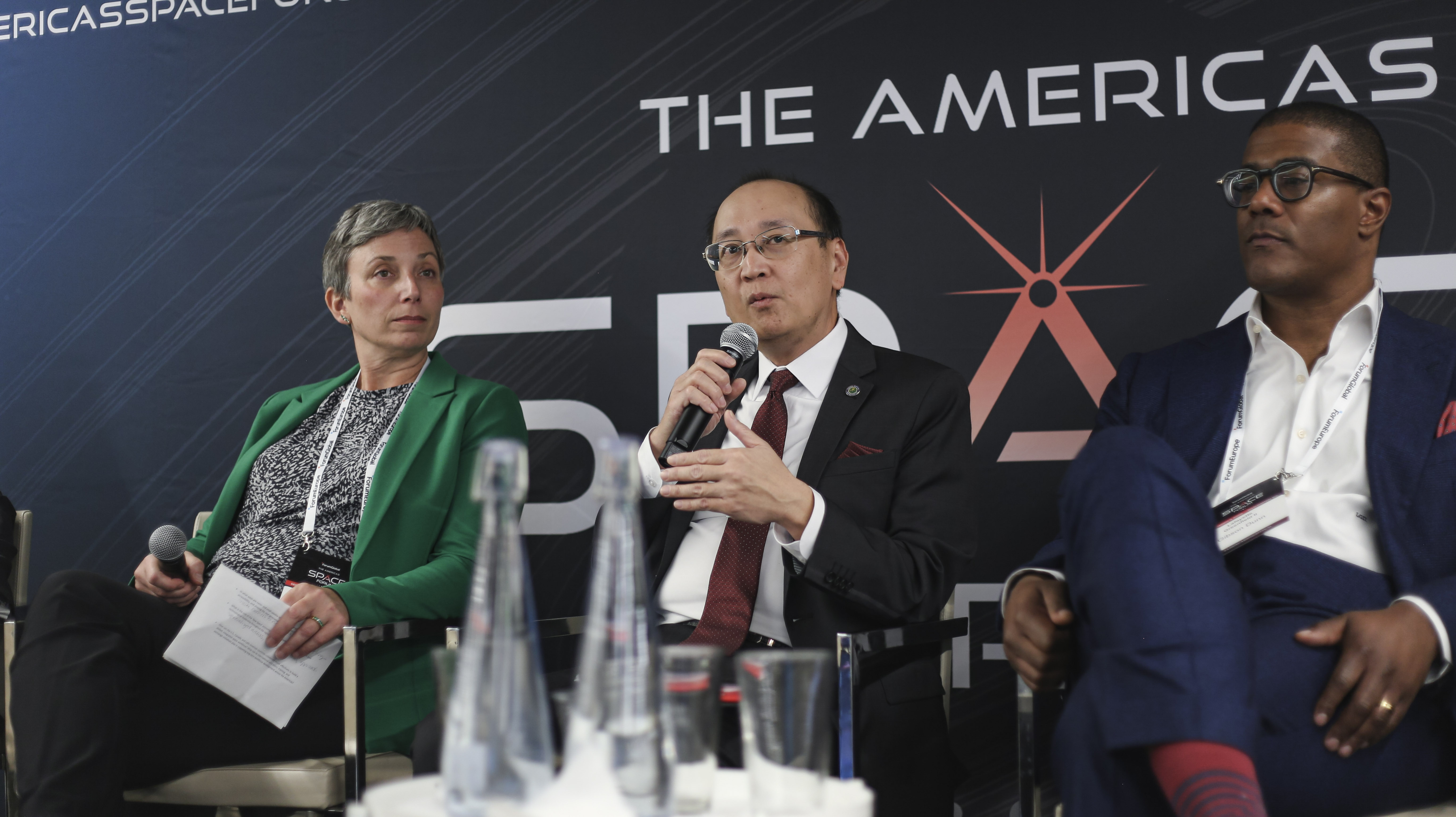 Minh Nguyen, FAA, withLafayette Greenfield II of Gibson Dunn and Janice Starzyk from the Office of Space Commerce. 